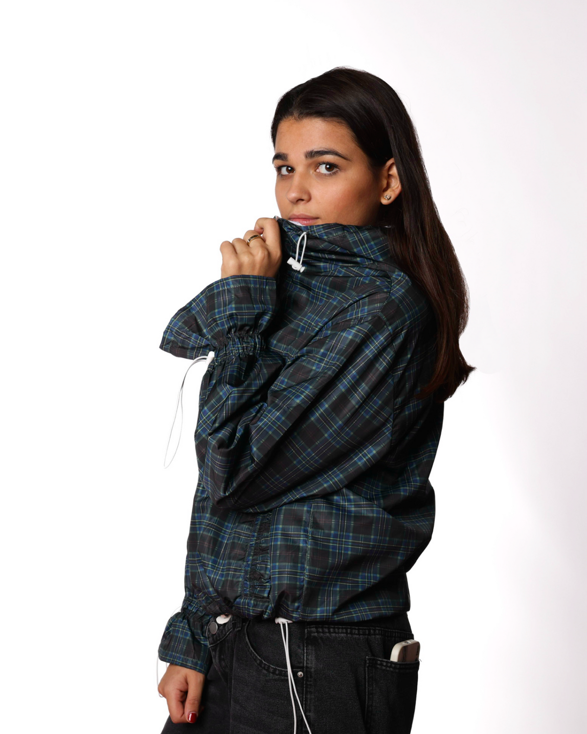 Person wearing a plaid jacket on a white background