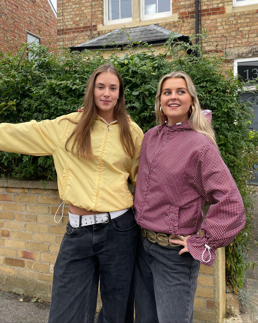 2 girls wearing gingham windbreakers